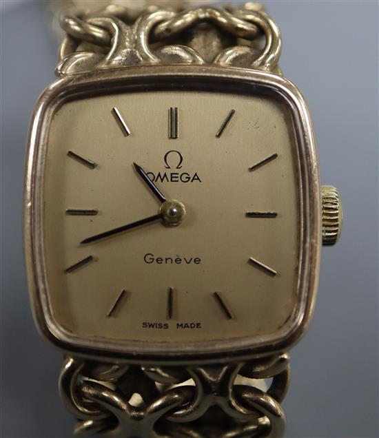 A ladys 1970s 9ct gold Omega manual wind wrist watch, on a 9ct gold Omega bracelet,